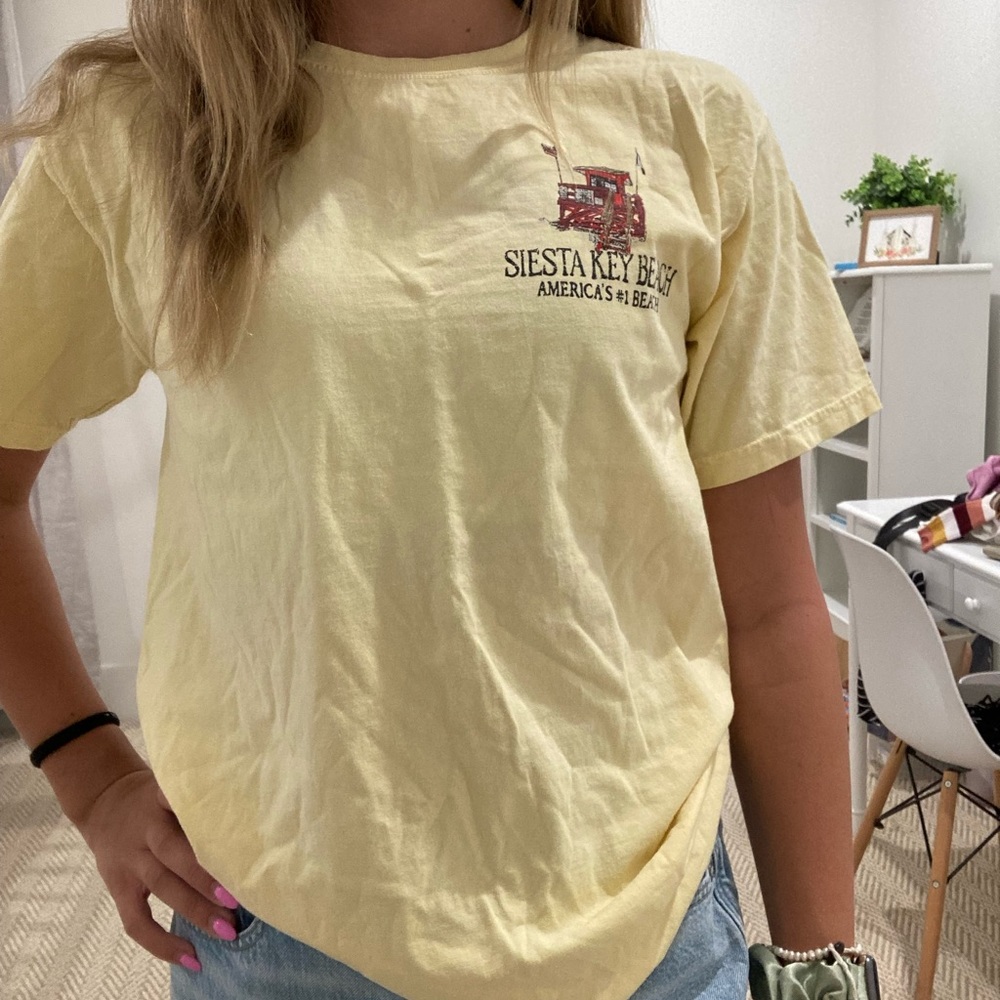 cute pastel yellow shirt loved it